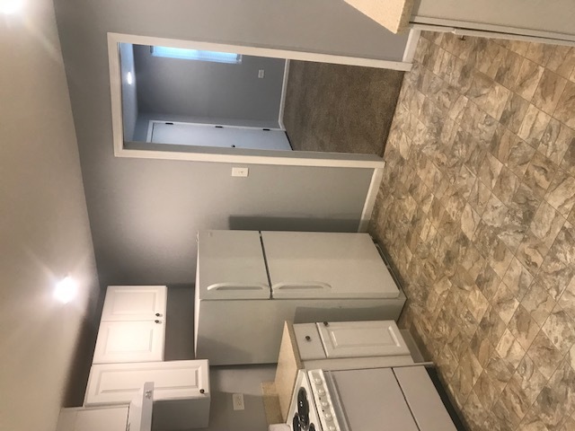 1721 Sheridan Road, Unit 4 Zion, IL 60099 - Photo 8 of 13 a view of washer and dryer with in the background