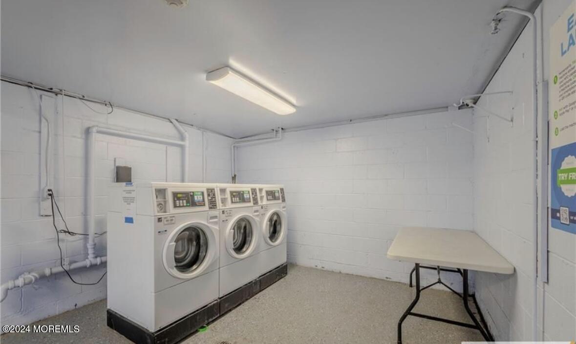 28 Manchester Court, Unit C Freehold, NJ 07728 - Photo 12 of 23 a utility room with dryer and washer