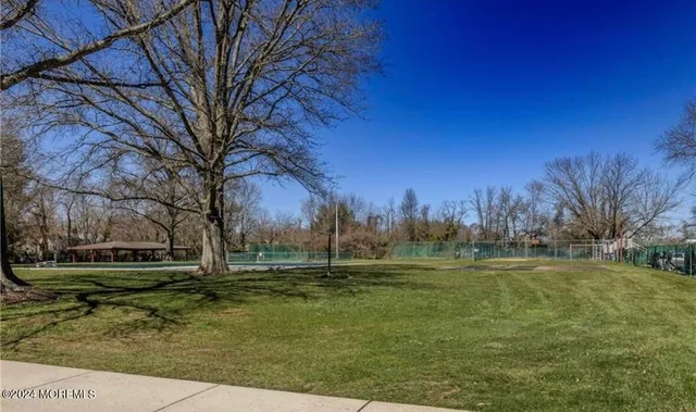 a backyard of apartments with large trees