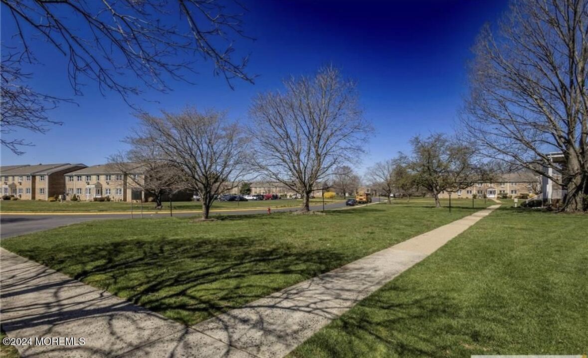 28 Manchester Court, Unit C Freehold, NJ 07728 - Photo 22 of 23 a view of a park with large trees