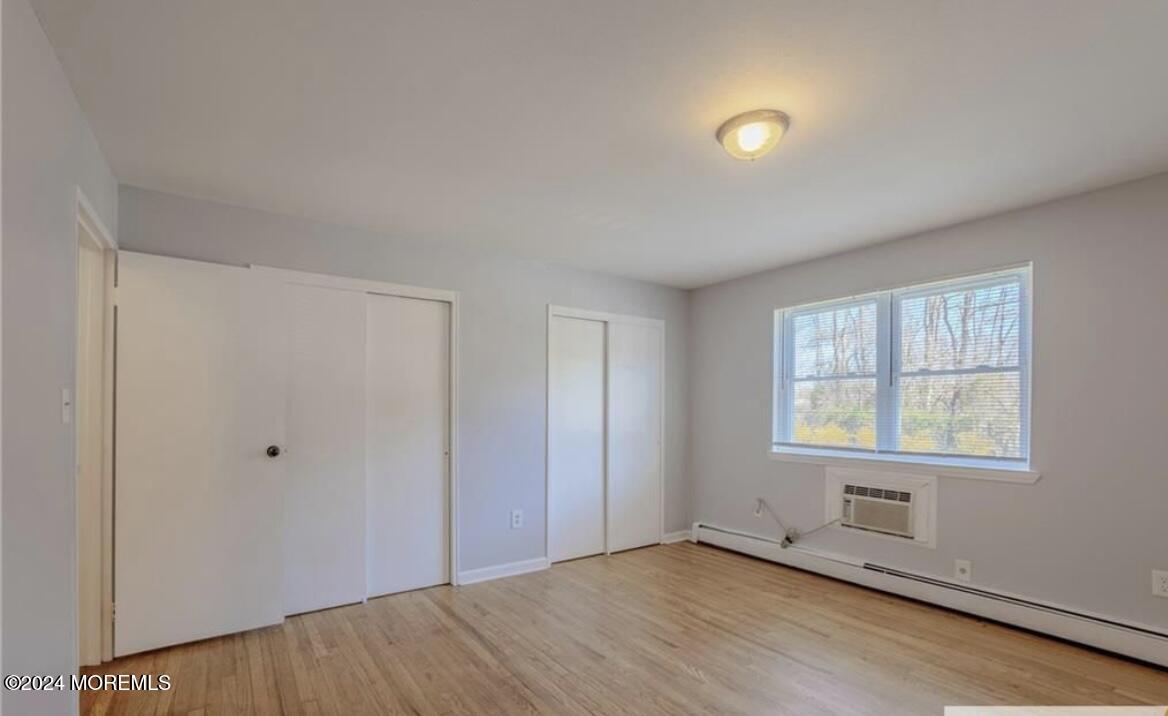 28 Manchester Court, Unit C Freehold, NJ 07728 - Photo 10 of 23 an empty room with windows