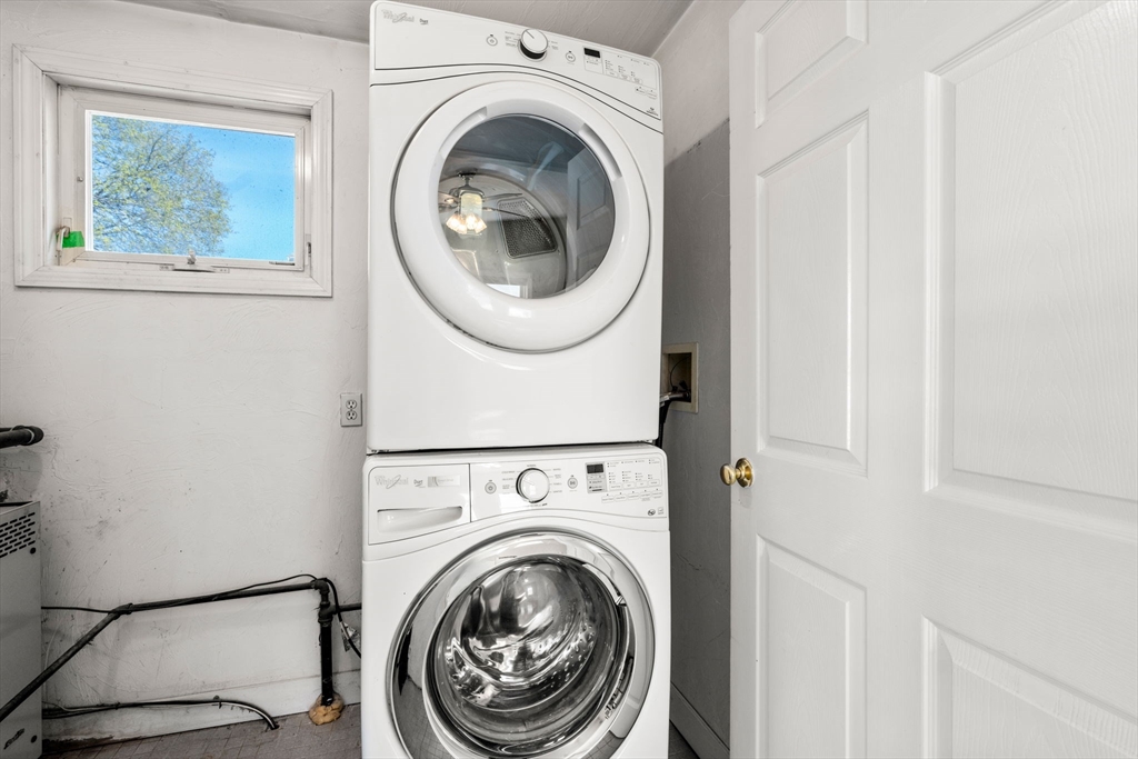 99 Proctor Road Braintree, MA 02184 - Photo 17 of 32 a view of a hallway with washer and dryer