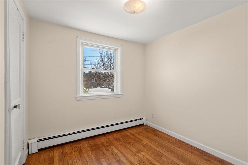 99 Proctor Road Braintree, MA 02184 - Photo 24 of 32 a view of a room with wooden floor and small window