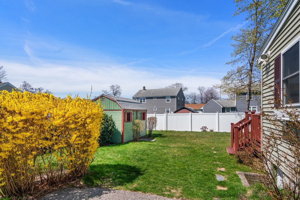 99 Proctor Road Braintree, MA 02184 - Photo 25 of 32 a view of a house with a big yard plants and large trees
