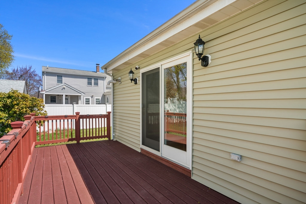 99 Proctor Road Braintree, MA 02184 - Photo 26 of 32 a view of a house with wooden deck