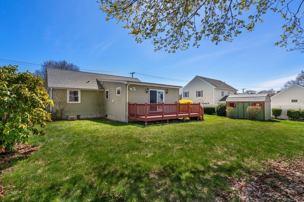 99 Proctor Road Braintree, MA 02184 - Photo 31 of 32 a front view of a house with garden