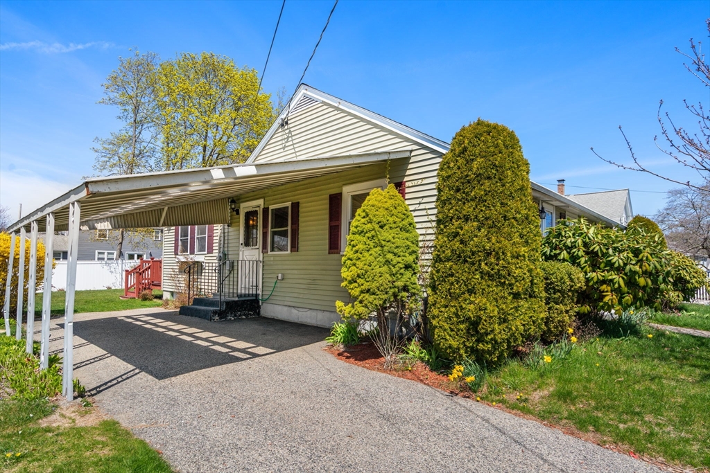 99 Proctor Road Braintree, MA 02184 - Photo 4 of 32 a front view of a house with a yard