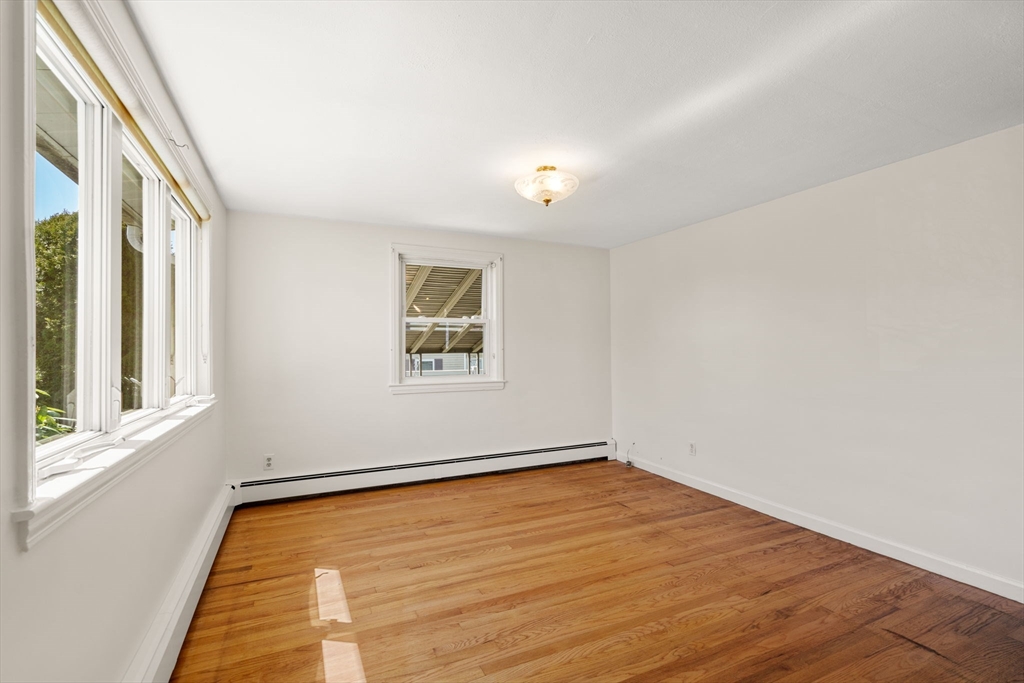 99 Proctor Road Braintree, MA 02184 - Photo 7 of 32 an empty room with a window