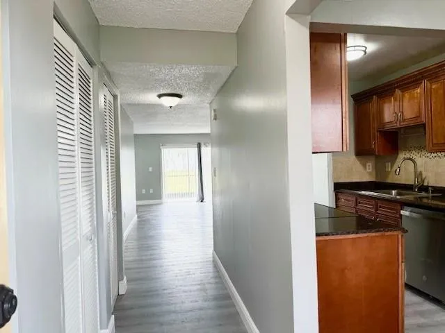 a view of a kitchen from the hallway