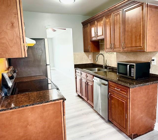 3110 North Pine Island Road, Unit 101 Sunrise, FL 33351 - Photo 4 of 14 a kitchen with stainless steel appliances granite countertop a stove a sink and a refrigerator