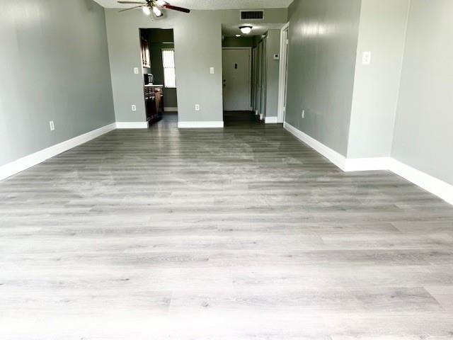 3110 North Pine Island Road, Unit 101 Sunrise, FL 33351 - Photo 6 of 14 a view of empty room with wooden floor