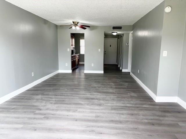 3110 North Pine Island Road, Unit 101 Sunrise, FL 33351 - Photo 7 of 14 a view of an empty room with wooden floor