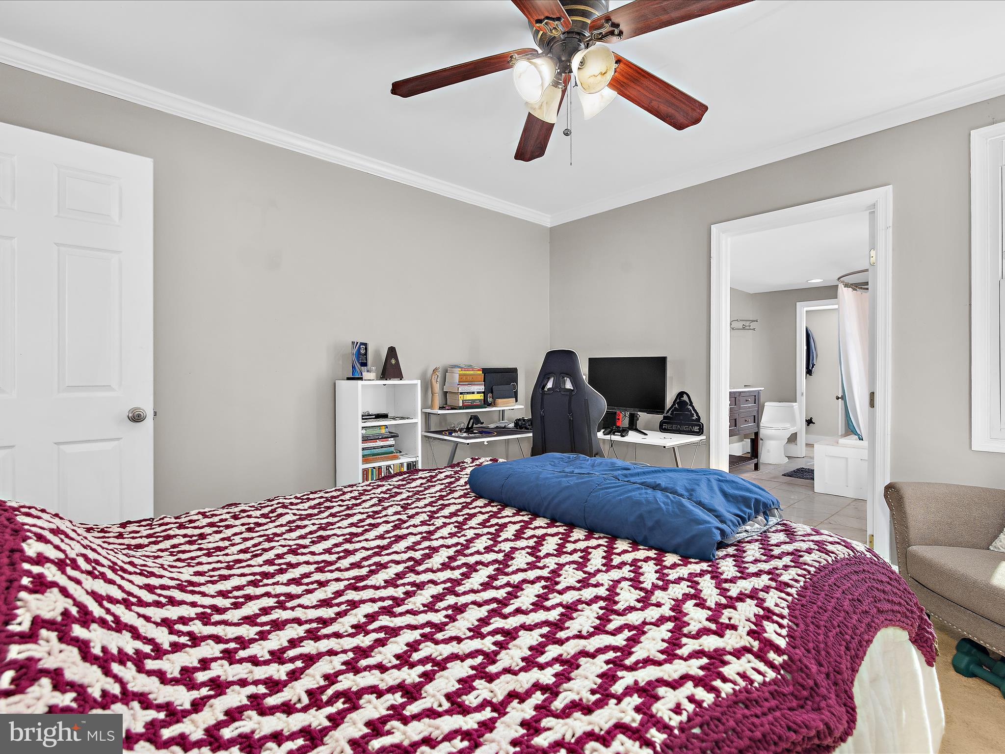 1313 Patapsco Street Baltimore, MD 21230 - Photo 16 of 30 a bedroom with a bed and a chandelier