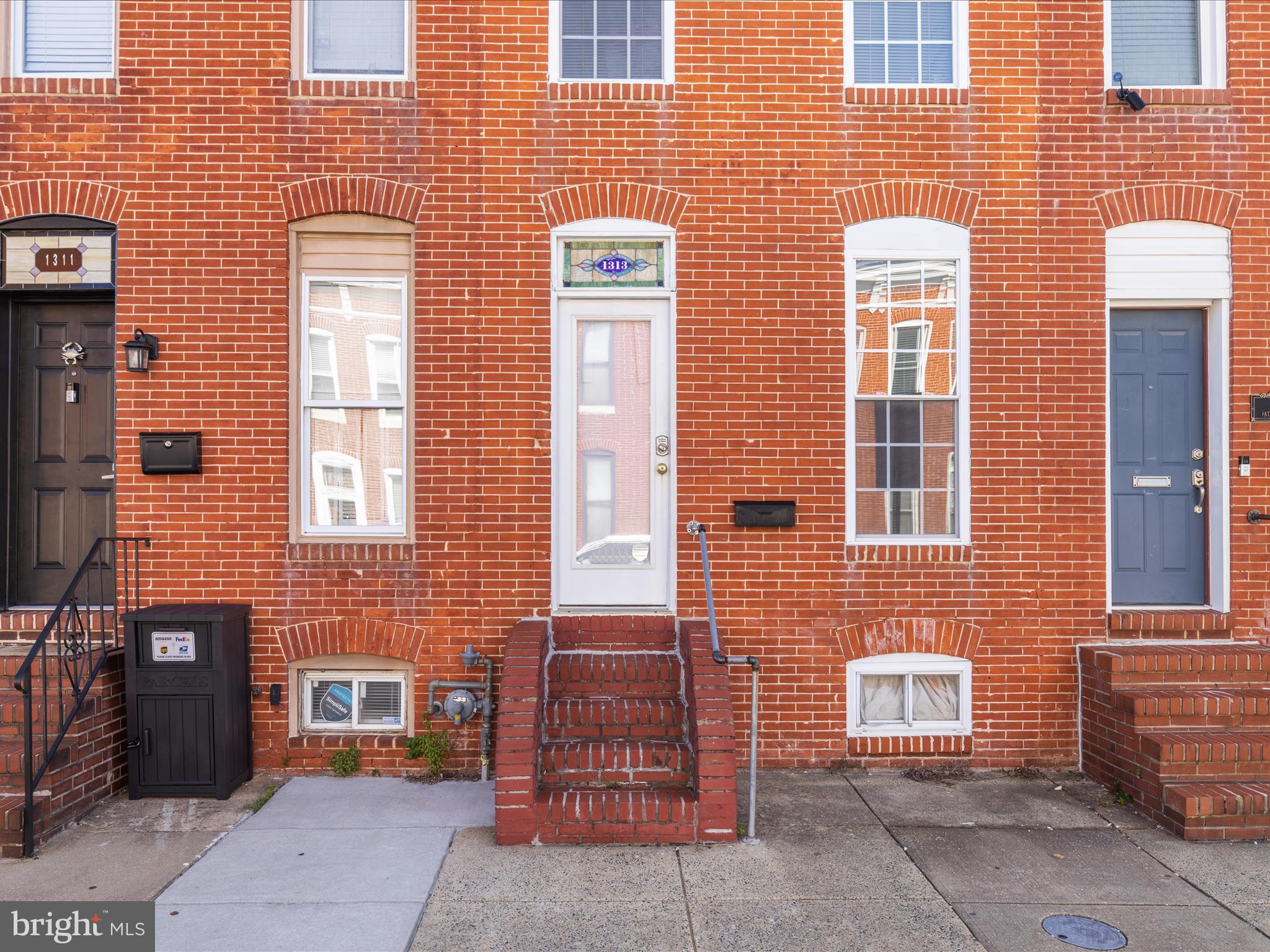 1313 Patapsco Street Baltimore, MD 21230 - Photo 2 of 30 a brick building with a couple of windows