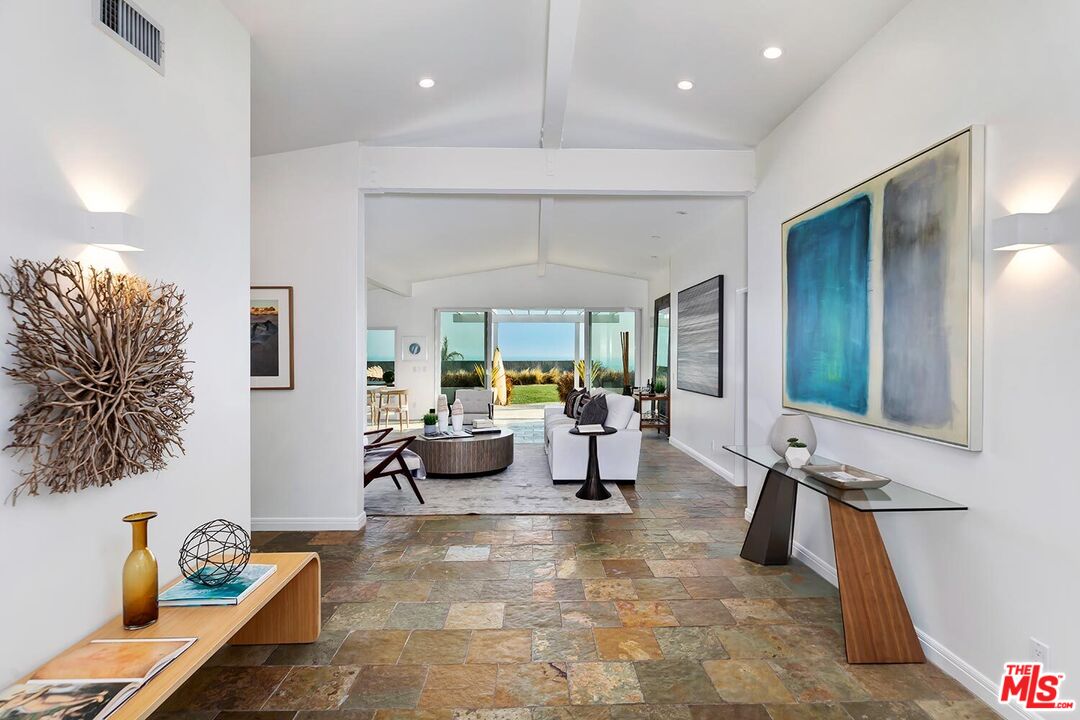 18106 Wakecrest Drive Malibu, CA 90265 - Photo 5 of 29 a living room with furniture and a large window