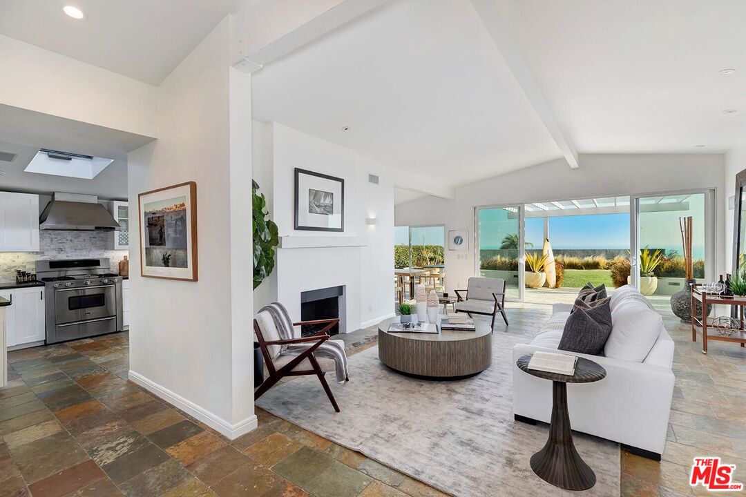 18106 Wakecrest Drive Malibu, CA 90265 - Photo 6 of 29 a living room with furniture and a table