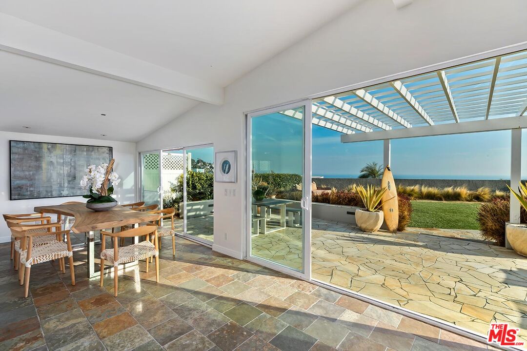 18106 Wakecrest Drive Malibu, CA 90265 - Photo 10 of 29 a view of a dining area with furniture window and outside view