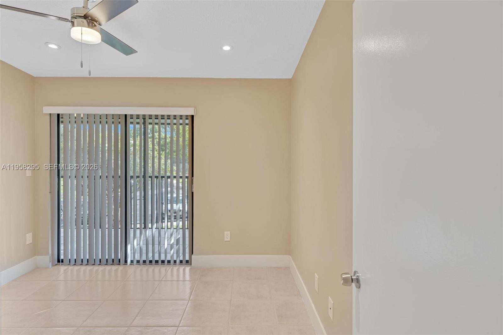9487 West McNab Road, Unit 205 Tamarac, FL 33321 - Photo 21 of 44 a view of a hallway