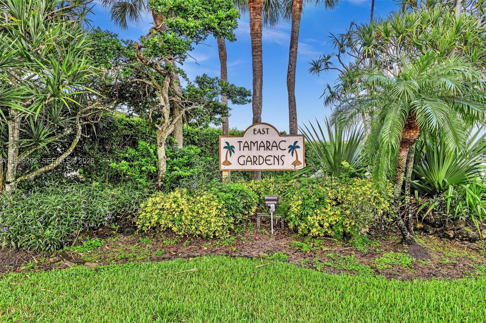 9487 West McNab Road, Unit 205 Tamarac, FL 33321 - Photo 31 of 44 a view of sign board and yard