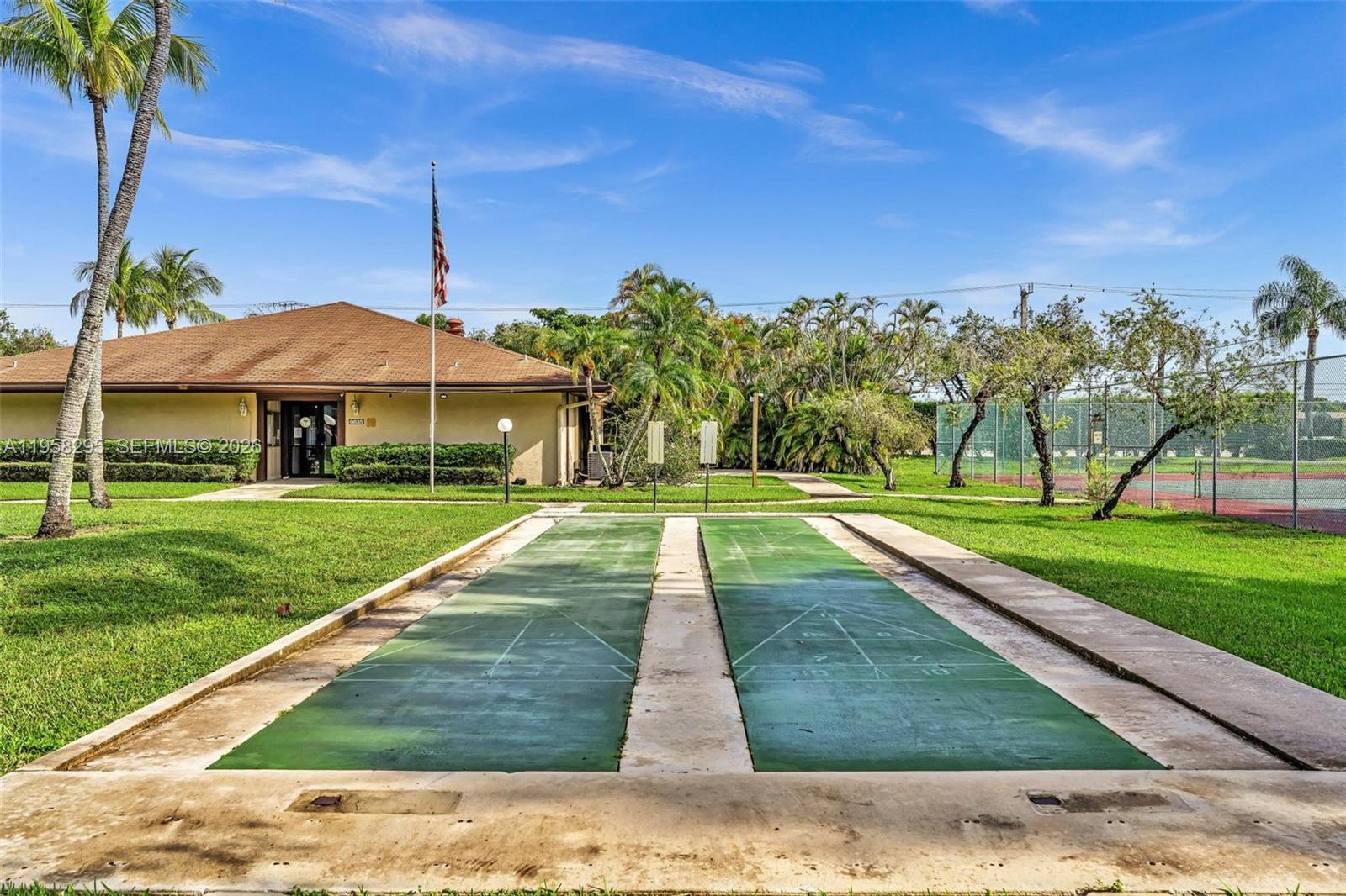 9487 West McNab Road, Unit 205 Tamarac, FL 33321 - Photo 37 of 44 a view of a park with large trees