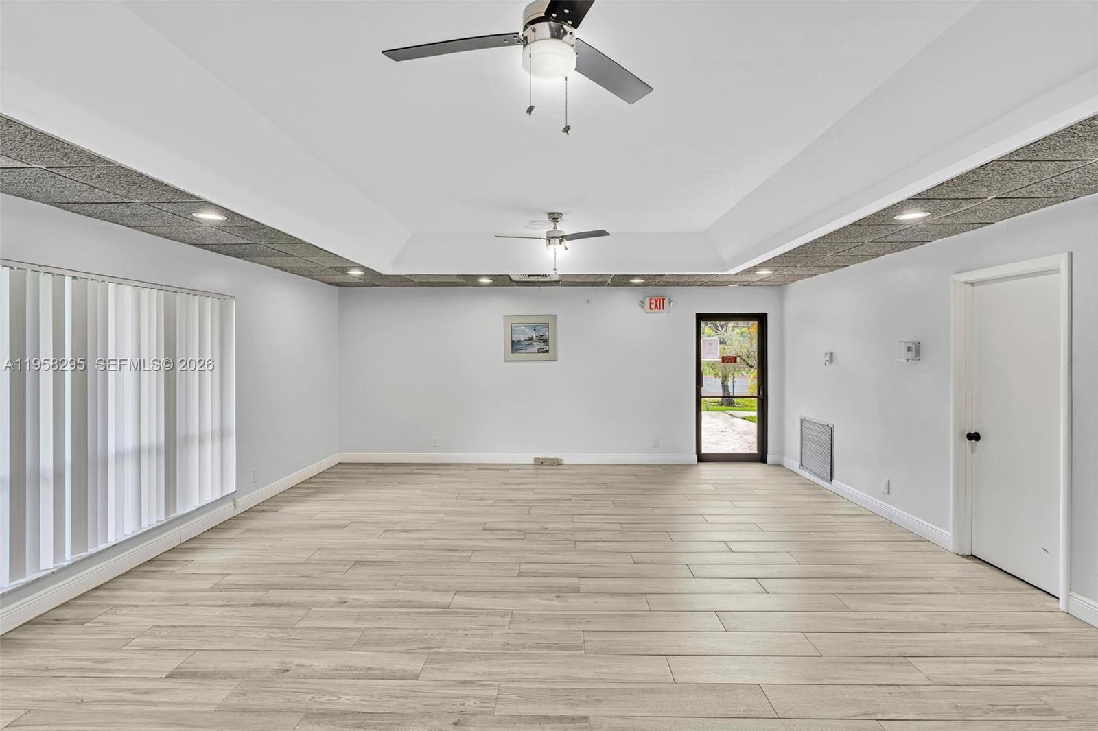 9487 West McNab Road, Unit 205 Tamarac, FL 33321 - Photo 41 of 44 a view of an empty room with a window