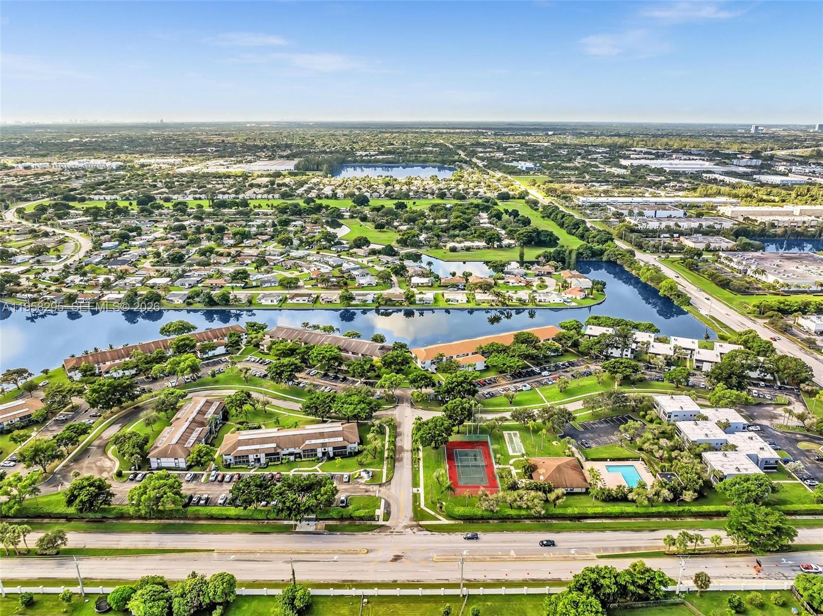 9487 West McNab Road, Unit 205 Tamarac, FL 33321 - Photo 44 of 44 an aerial view of residential building and lake