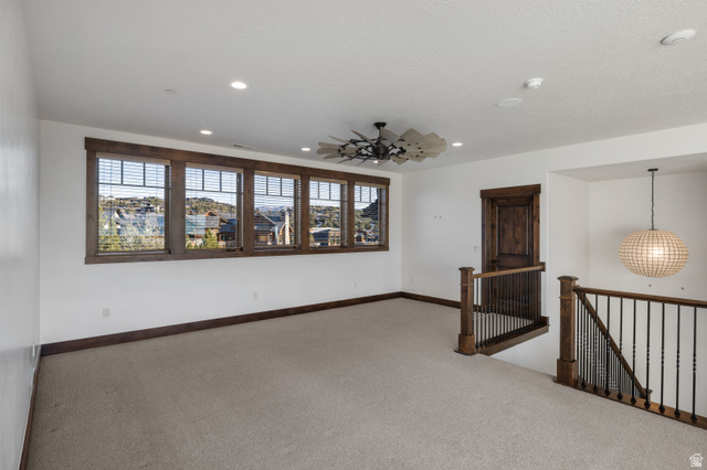 707 Chimney Rock Road, Unit 247 Heber City, UT 84032 - Photo 25 of 64 Empty room with carpet floors and recessed lighting