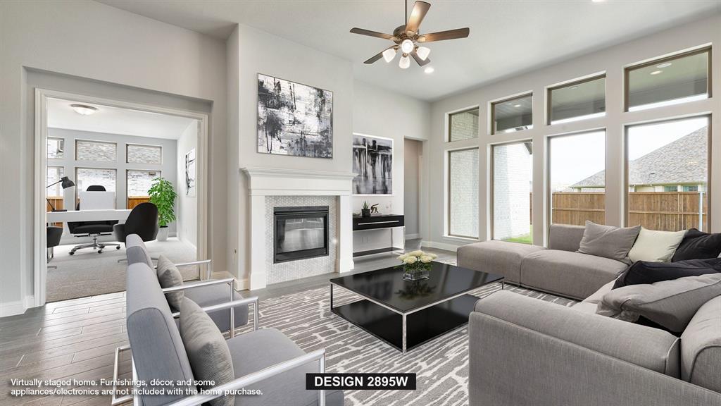 907 River Sky Road Lavon, TX 75166 - Photo 5 of 21 a living room with furniture a fireplace and a large window