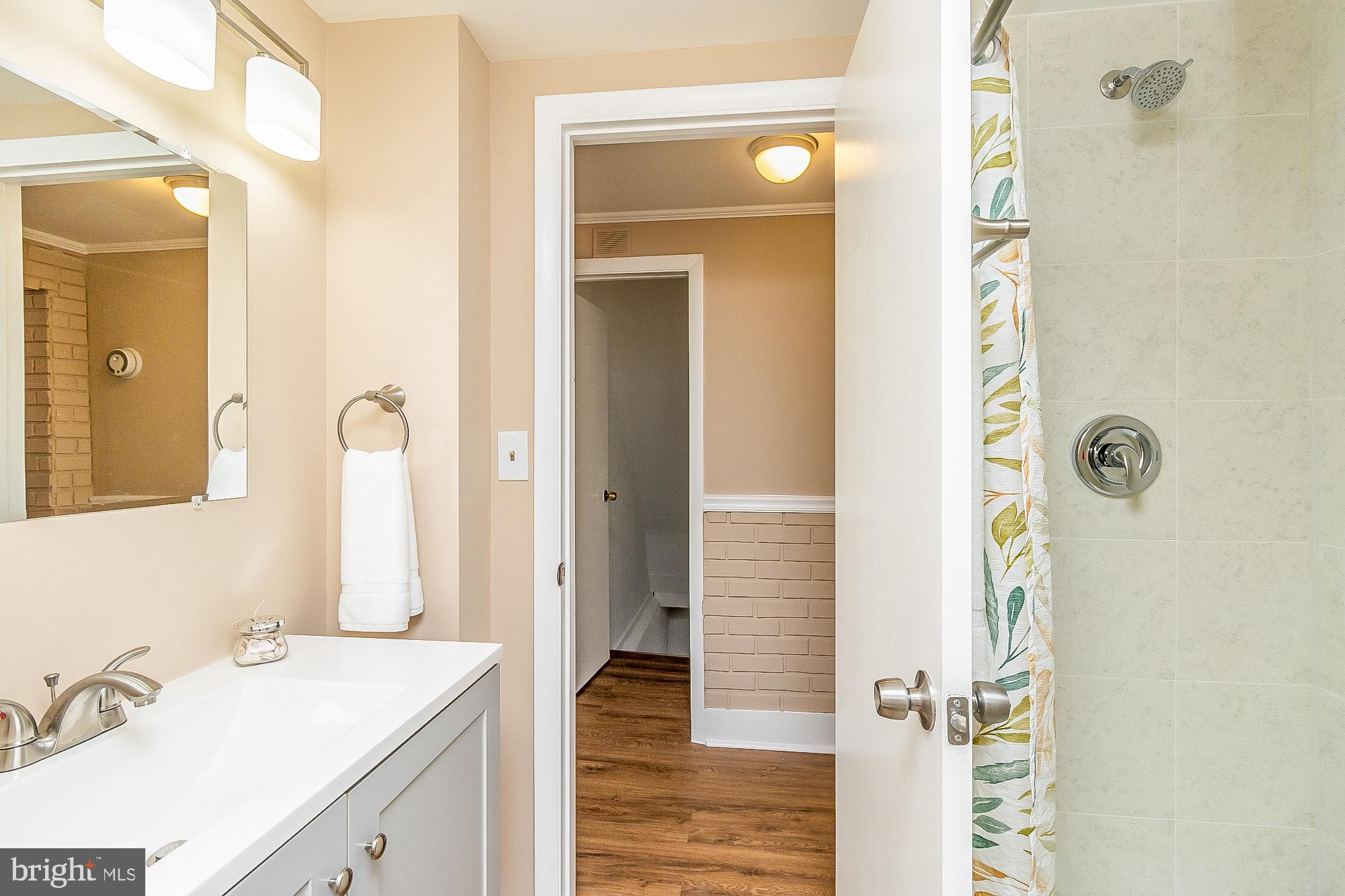7501 Kenlea Avenue Nottingham, MD 21236 - Photo 13 of 55 a bathroom with a sink and shower