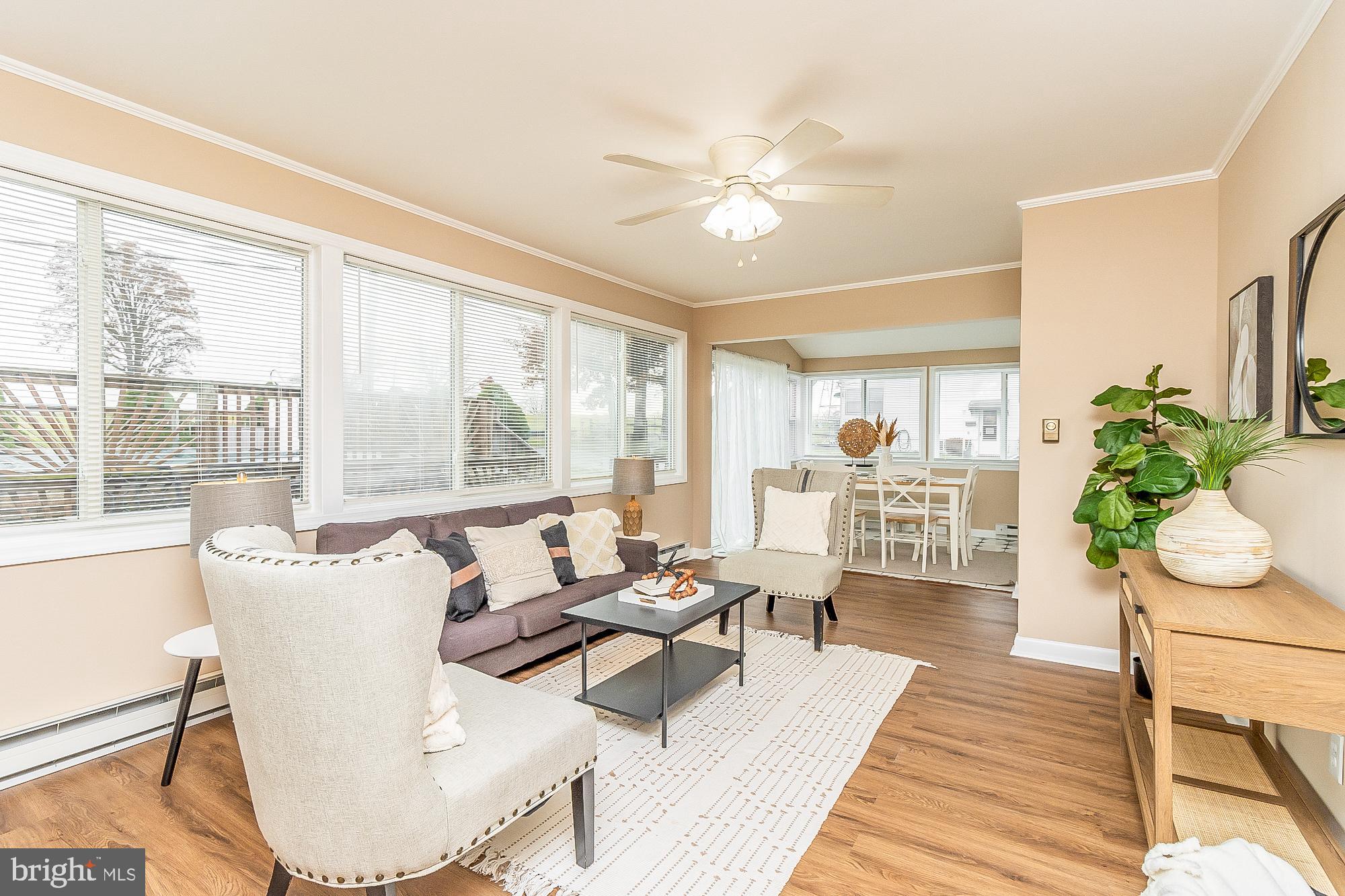 7501 Kenlea Avenue Nottingham, MD 21236 - Photo 14 of 55 a living room with furniture and floor to ceiling windows