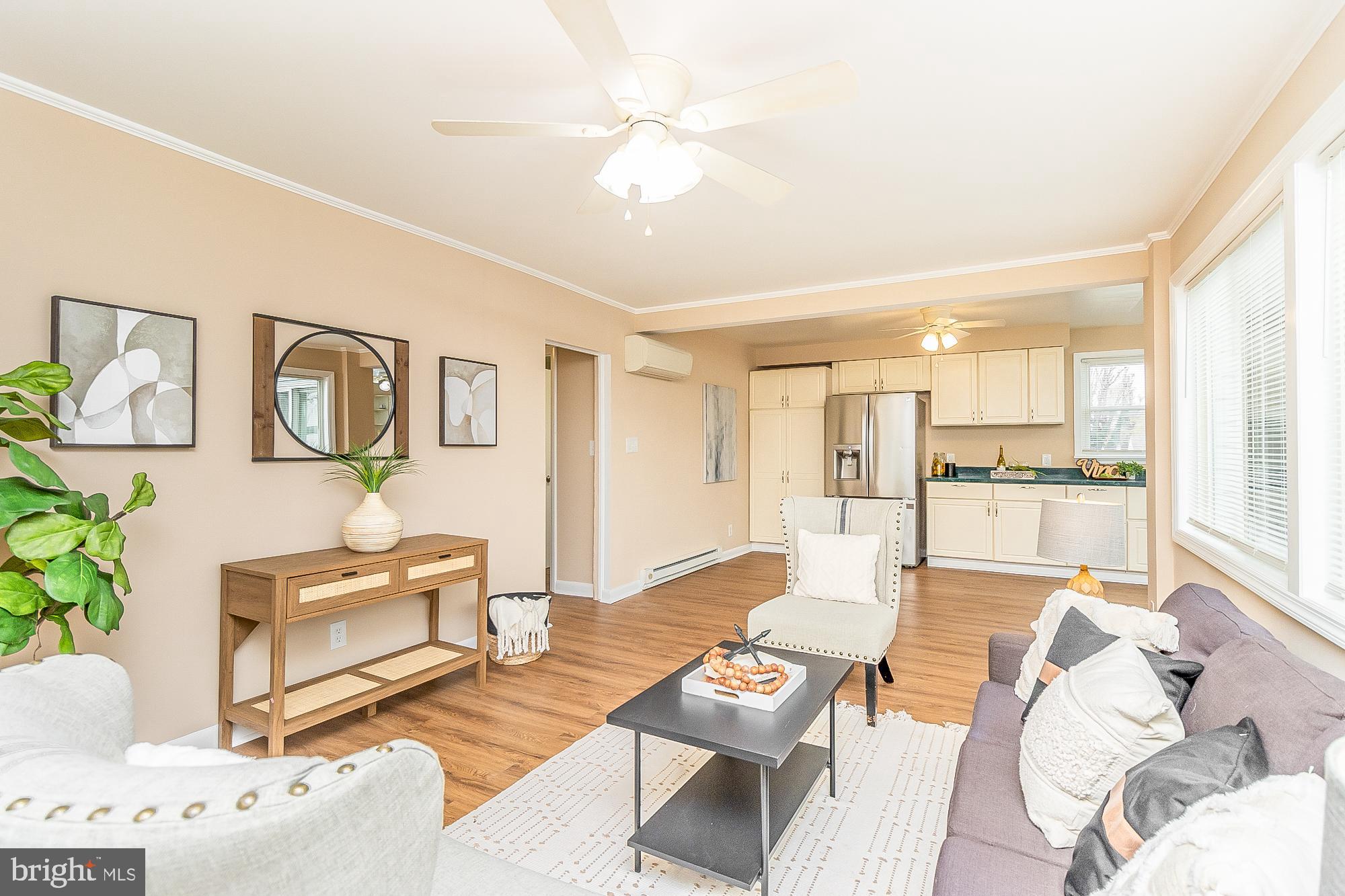 7501 Kenlea Avenue Nottingham, MD 21236 - Photo 17 of 55 a living room with fireplace furniture and a large window