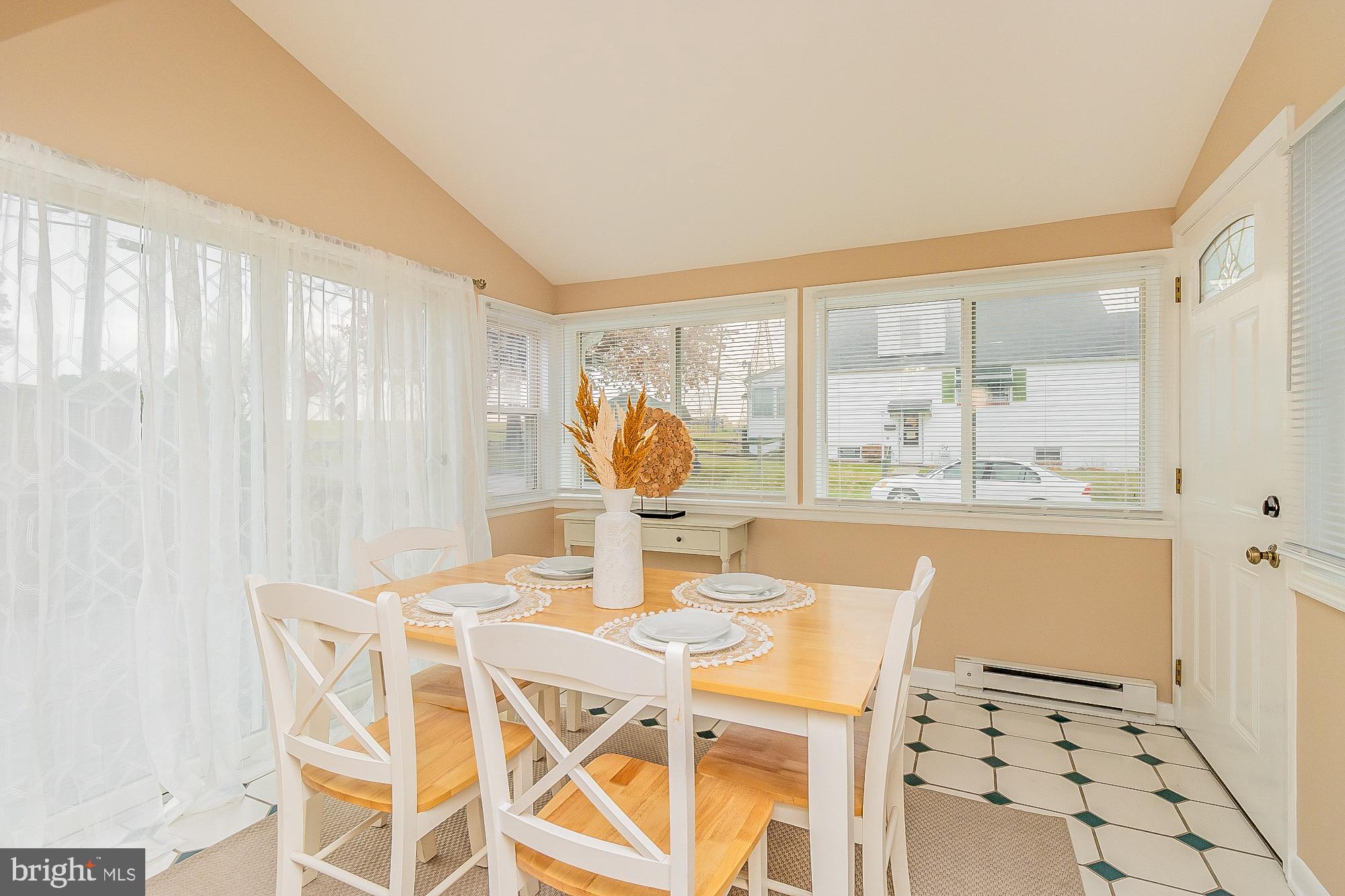 7501 Kenlea Avenue Nottingham, MD 21236 - Photo 19 of 55 a dining room with furniture and large windows