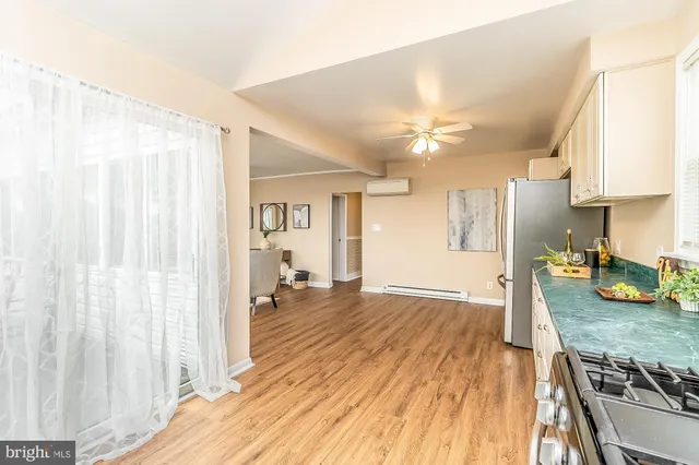 a kitchen with stainless steel appliances granite countertop a stove and a refrigerator