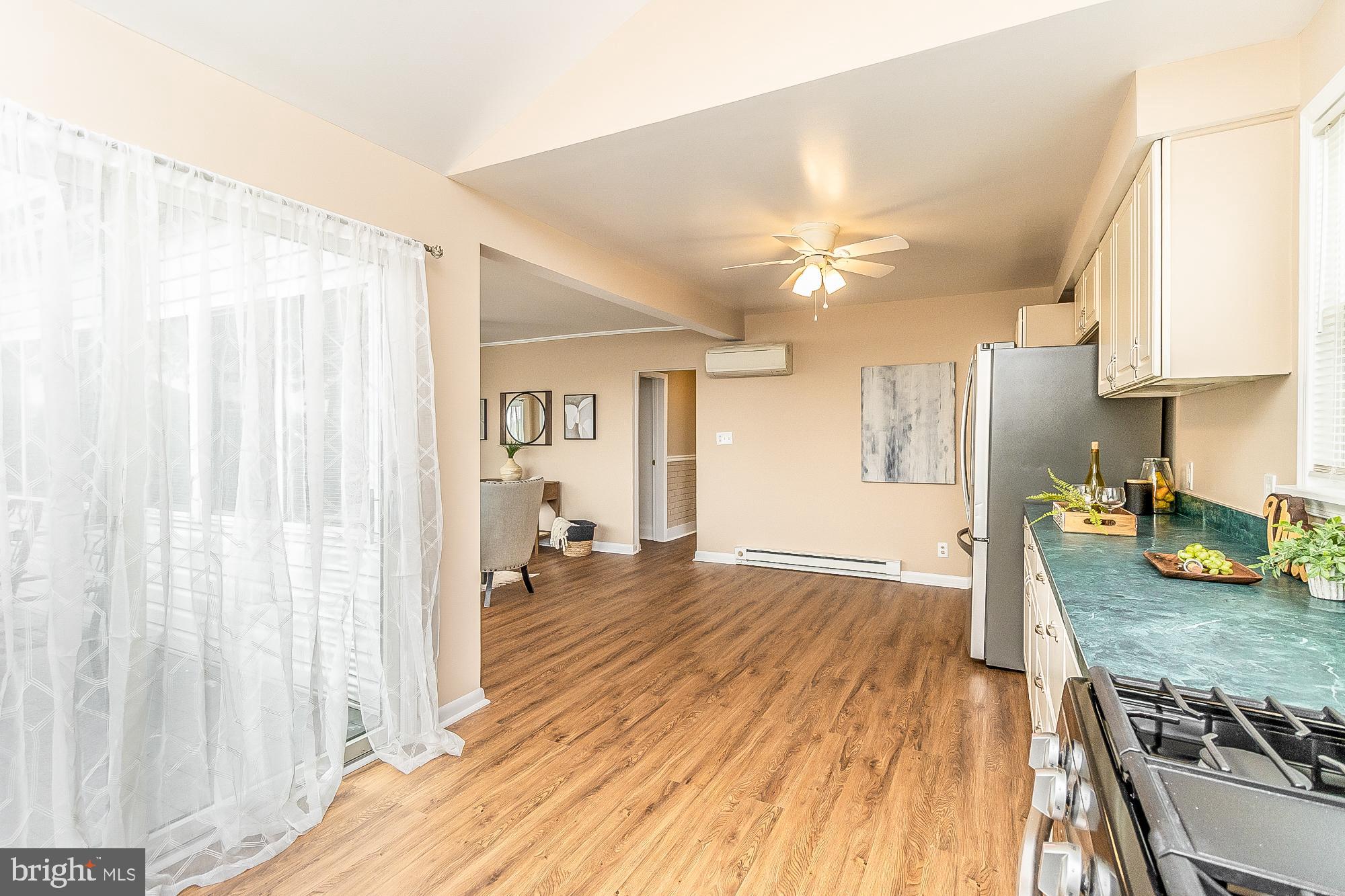 7501 Kenlea Avenue Nottingham, MD 21236 - Photo 24 of 55 a view of a kitchen with stove and wooden floor