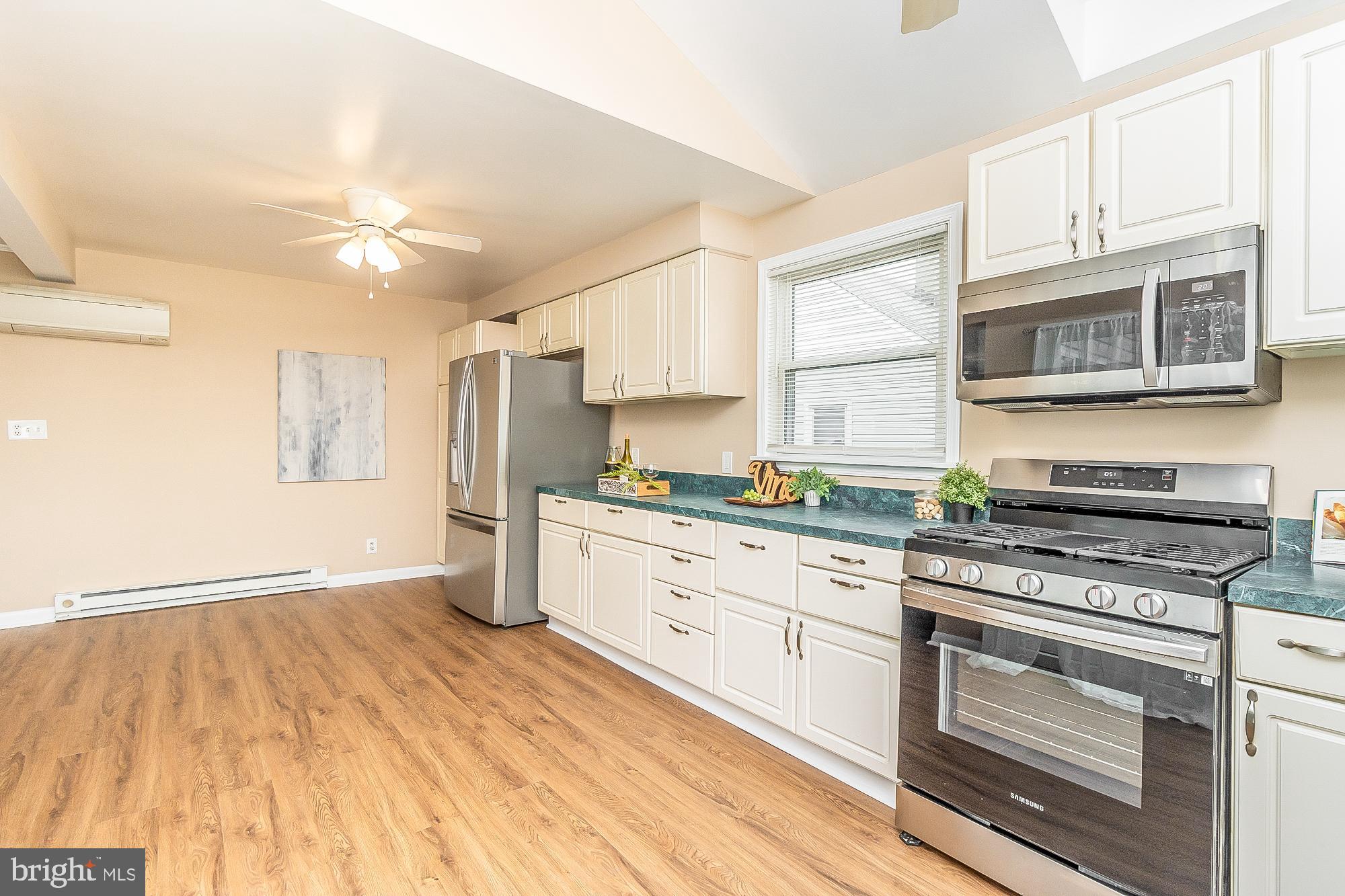 7501 Kenlea Avenue Nottingham, MD 21236 - Photo 25 of 55 a kitchen with stainless steel appliances granite countertop a stove and a refrigerator