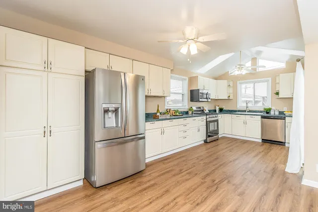 a bed room with a bed and a chandelier