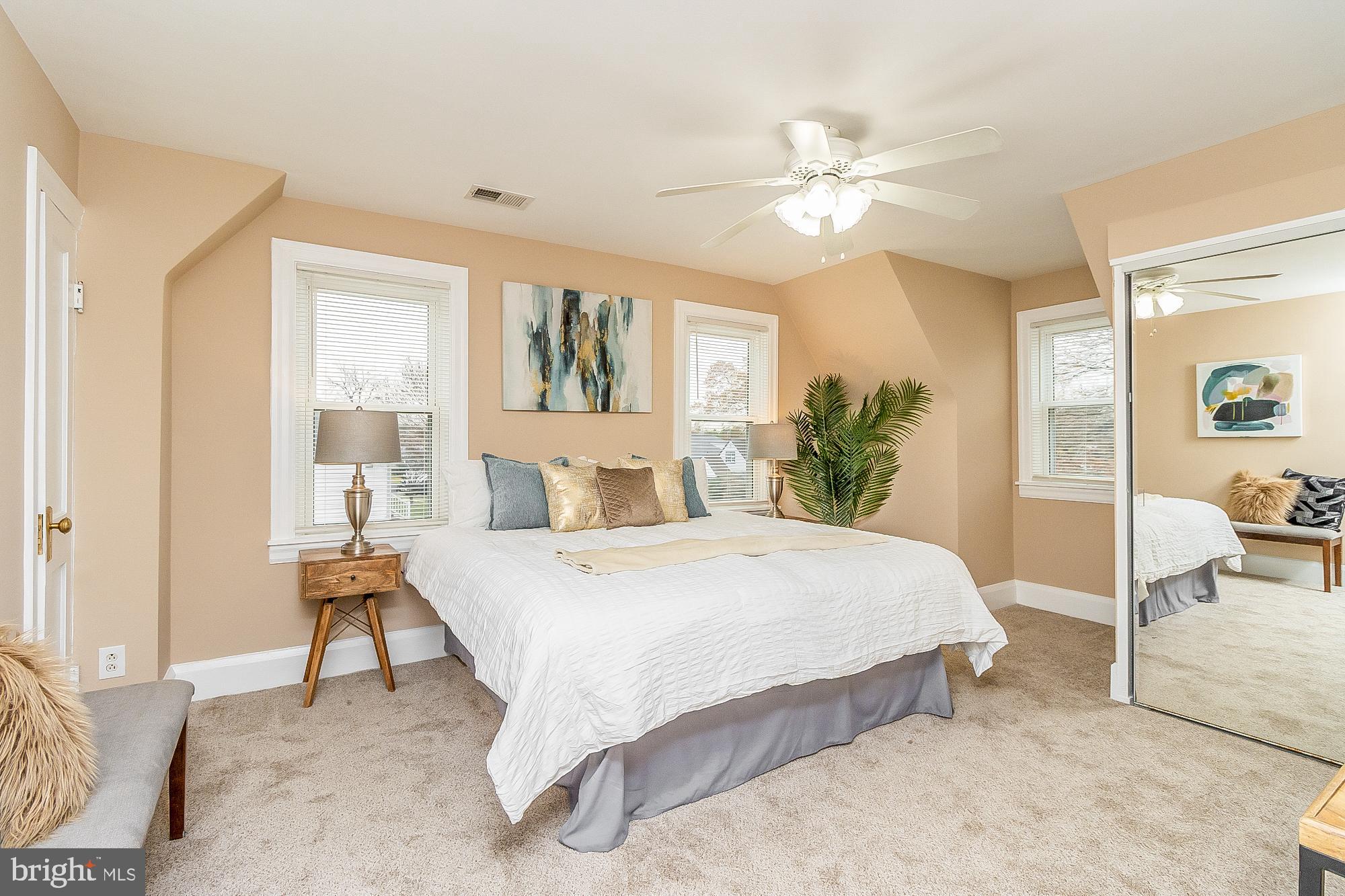 7501 Kenlea Avenue Nottingham, MD 21236 - Photo 29 of 55 a bed room with a bed and a chandelier