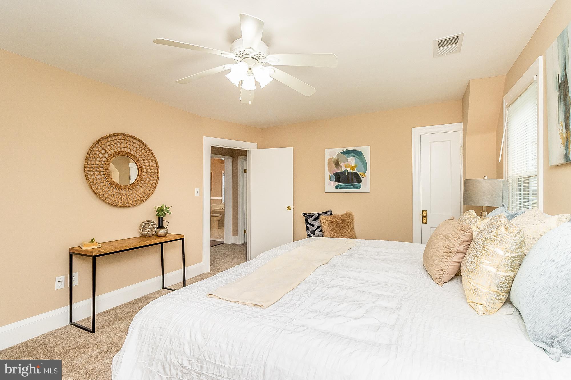 7501 Kenlea Avenue Nottingham, MD 21236 - Photo 30 of 55 a bedroom with a bed and a chandelier