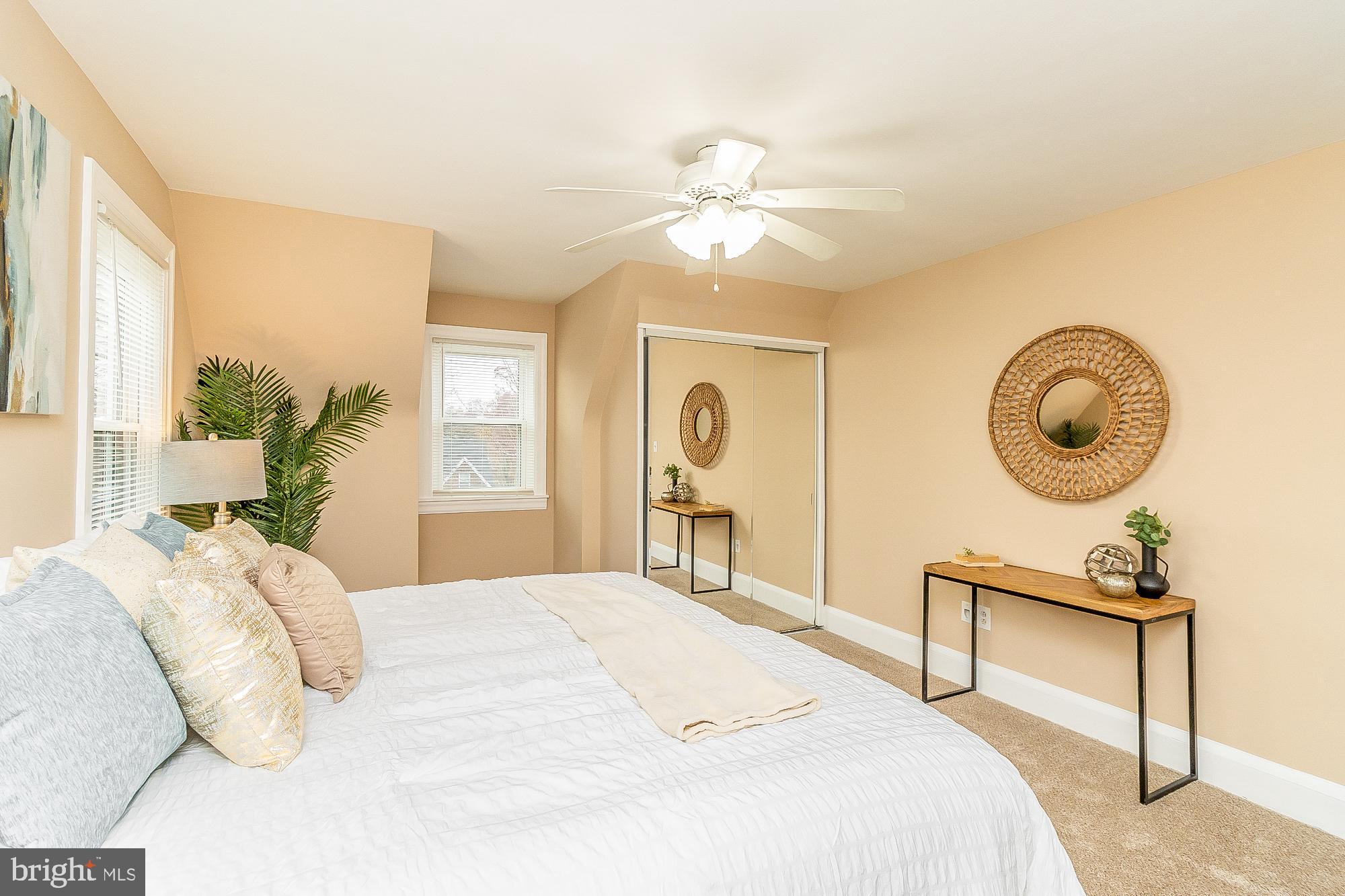 7501 Kenlea Avenue Nottingham, MD 21236 - Photo 31 of 55 a bedroom with a bed and a chandelier