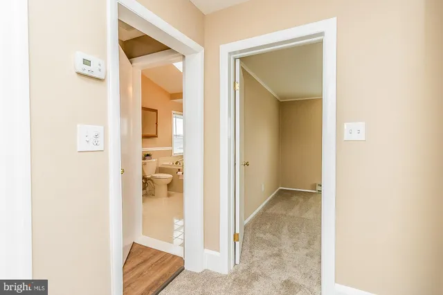 a bathroom with a tub sink and a mirror