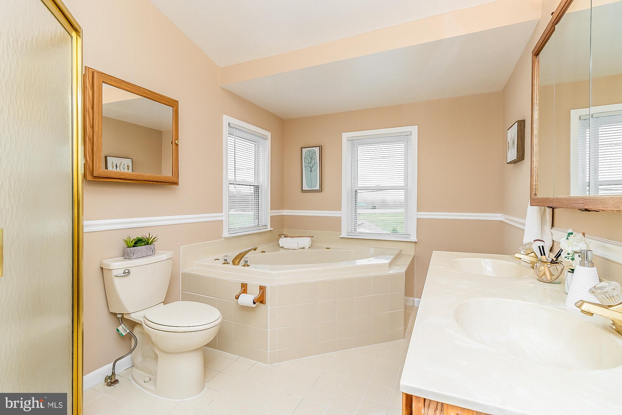 7501 Kenlea Avenue Nottingham, MD 21236 - Photo 37 of 55 a bathroom with a sink a toilet and a mirror