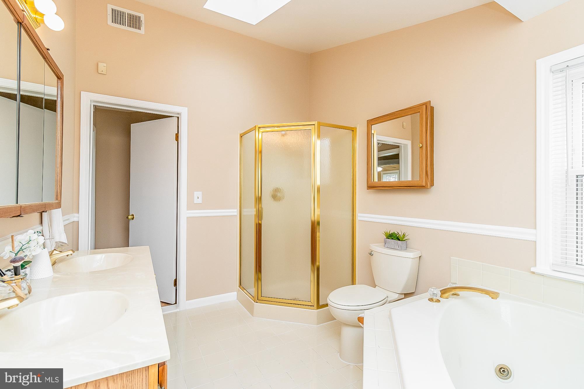 7501 Kenlea Avenue Nottingham, MD 21236 - Photo 38 of 55 a bathroom with a tub sink and a mirror