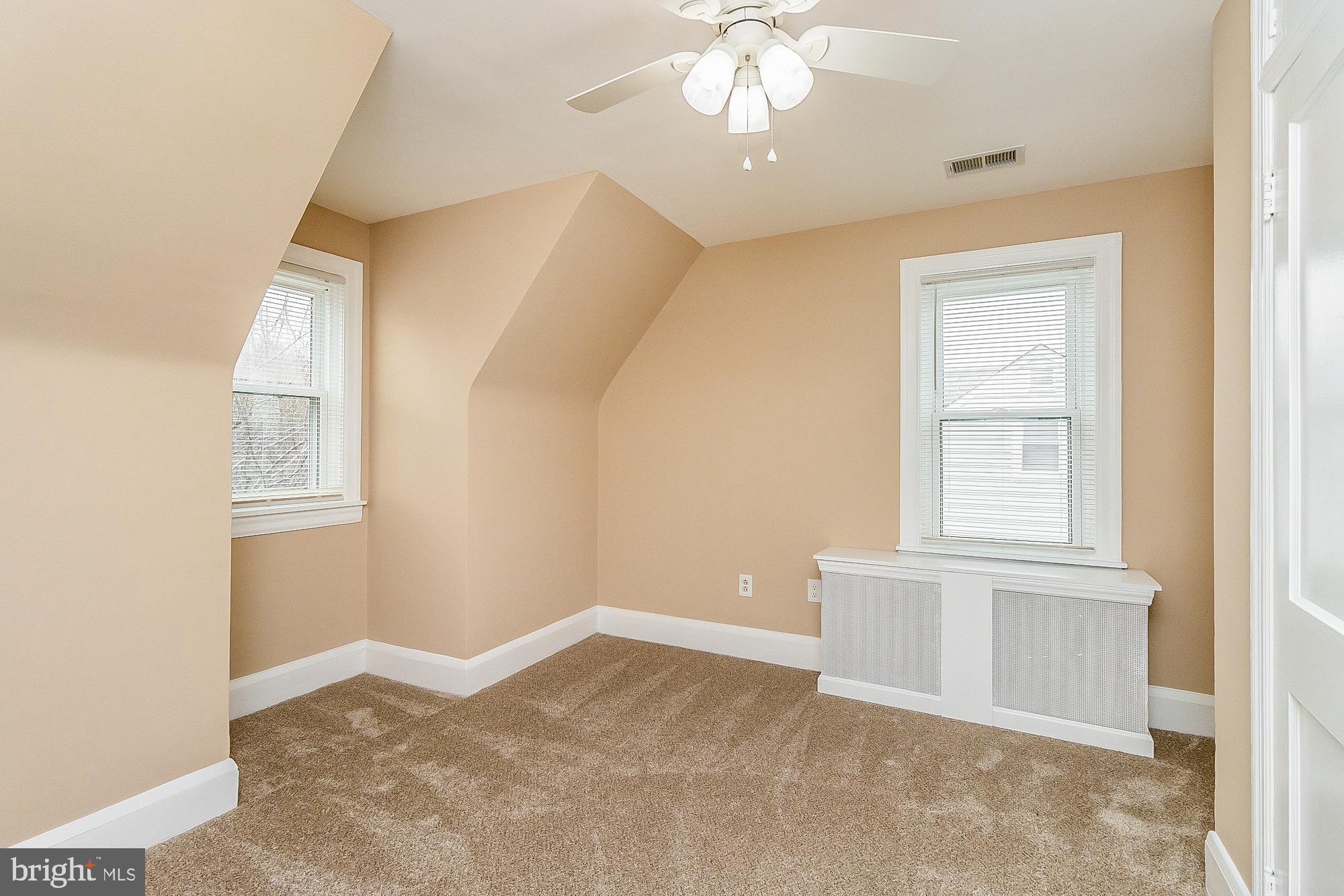 7501 Kenlea Avenue Nottingham, MD 21236 - Photo 41 of 55 an empty room with windows and fan