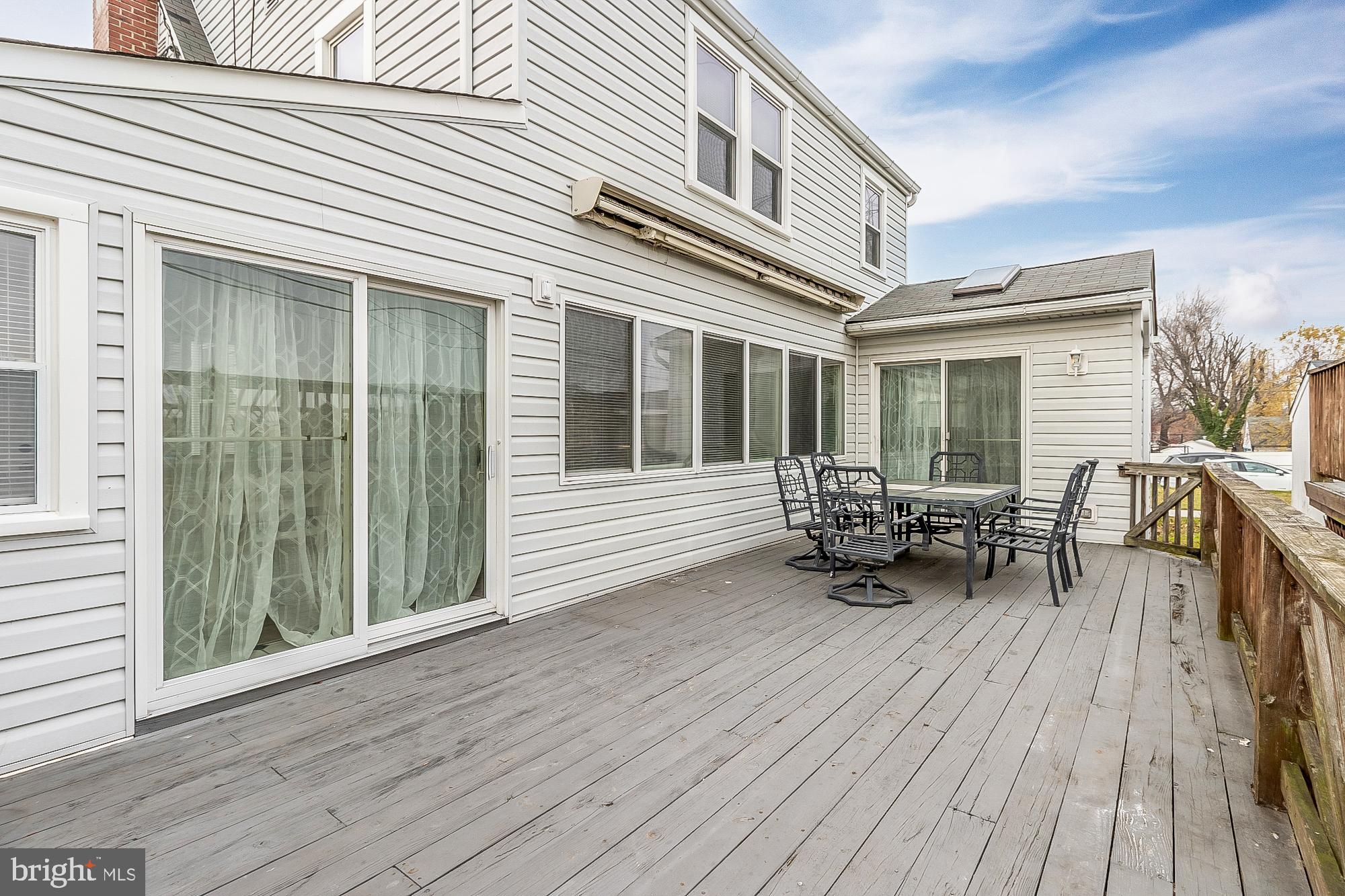 7501 Kenlea Avenue Nottingham, MD 21236 - Photo 49 of 55 a view of a house with sitting area and wooden bench