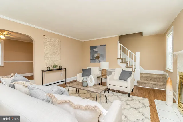a living room with furniture and a table