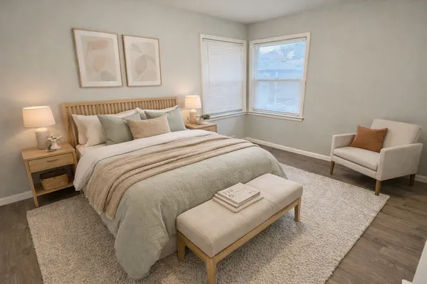 a bedroom with bed and window