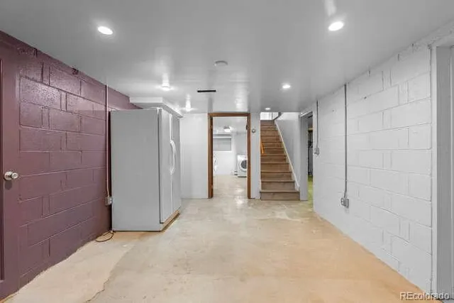 a view of an empty room with a bathroom