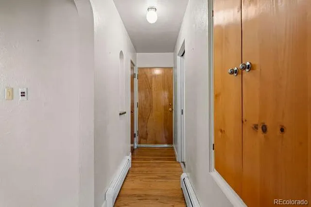 a view of a bathroom from a hallway