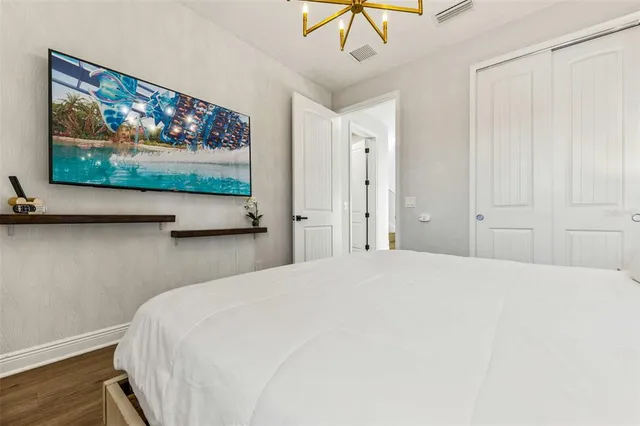 a front view of house with a garden and patio