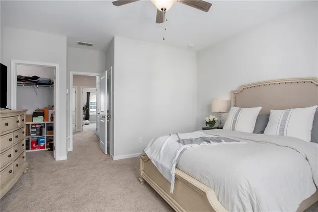 a bedroom with a bed and a walk in closet